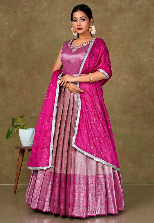 Woman in a pink gown with a matching blouse