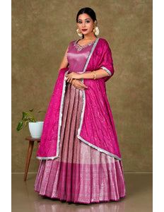 Woman in a pink gown with a matching blouse