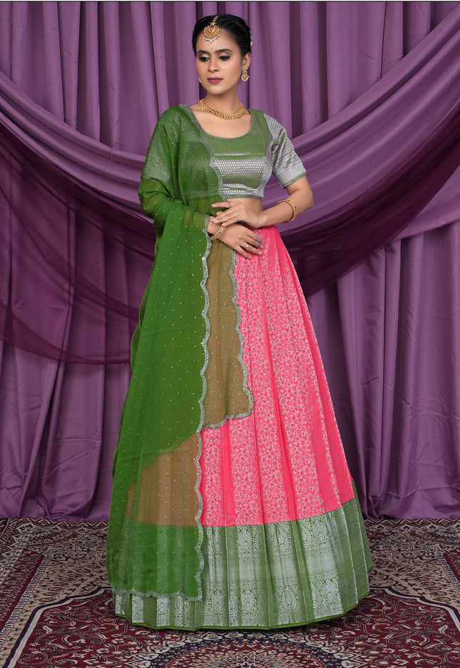 Woman wearing a green and pink traditional outfit