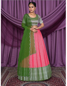 Woman wearing a green and pink traditional outfit