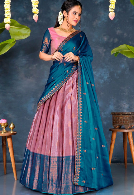 Woman wearing a blue and pink lehenga choli with dupatta