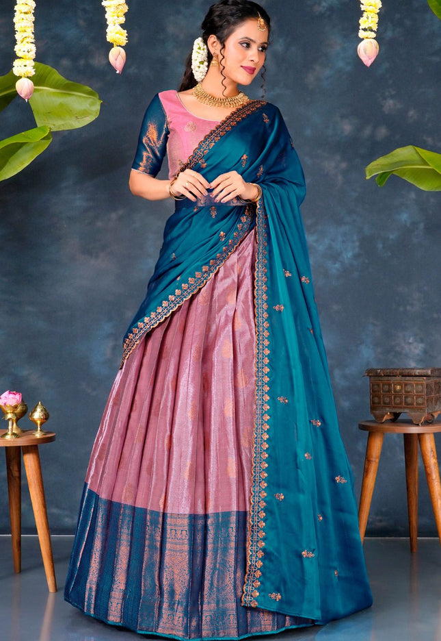 Woman wearing a blue and pink lehenga choli with dupatta