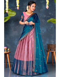 Woman wearing a blue and pink lehenga choli with dupatta