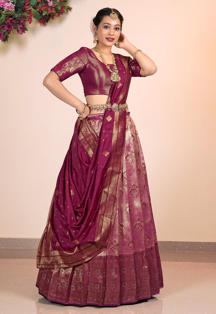Woman wearing a traditional Pink Half-Saree with gold patterns