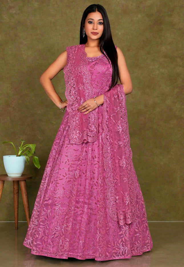 Woman wearing a pink embroidered dress  Pink Colour Party Wear Net Gown For Women