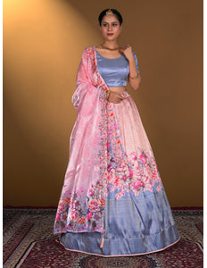 Woman wearing a pink and blue floral lehenga with a matching blouse