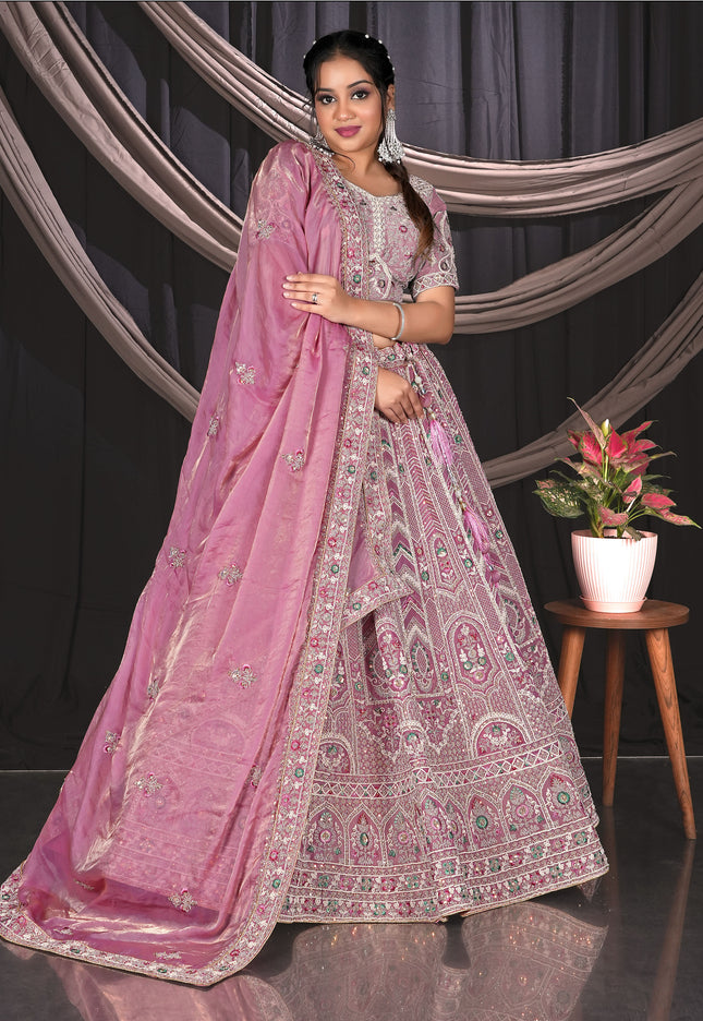 Woman in a pink embroidered traditional Lehenga Choli