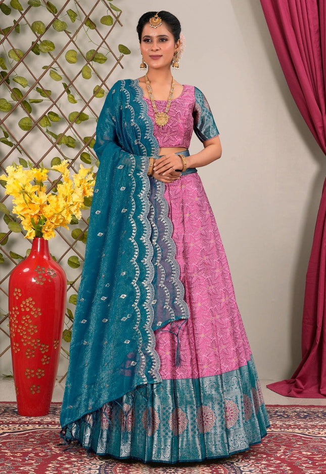 Woman in a pink and blue traditional lehenga choli with dupatta