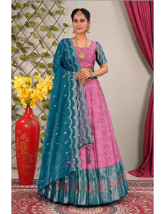 Woman in a pink and blue traditional lehenga choli with dupatta