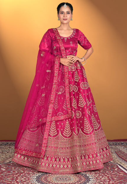 Woman wearing a traditional pink embroidered outfit