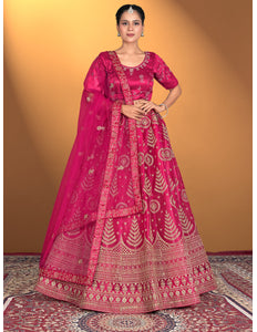 Woman wearing a traditional pink embroidered outfit