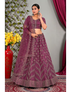 Woman in a purple embroidered traditional lehenga choli