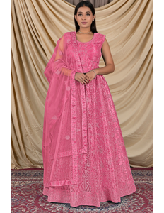 Woman wearing a pink traditional outfit with a matching dupatta