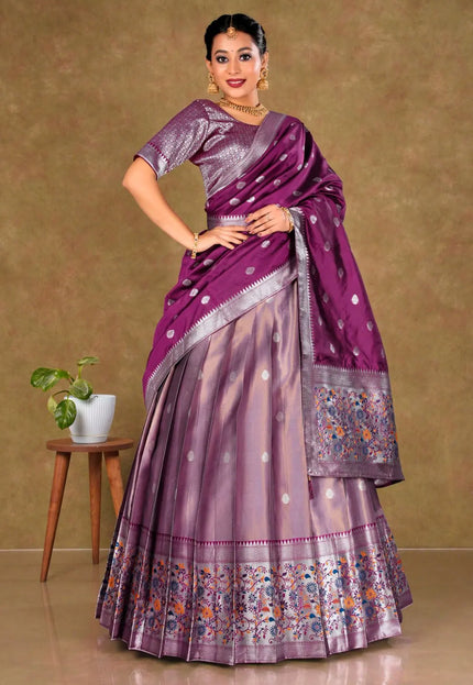 Woman wearing a pink lehenga with a matching blouse