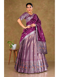 Woman wearing a pink lehenga with a matching blouse
