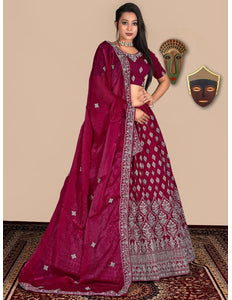 Woman wearing a pink lehenga choli with white patterns
