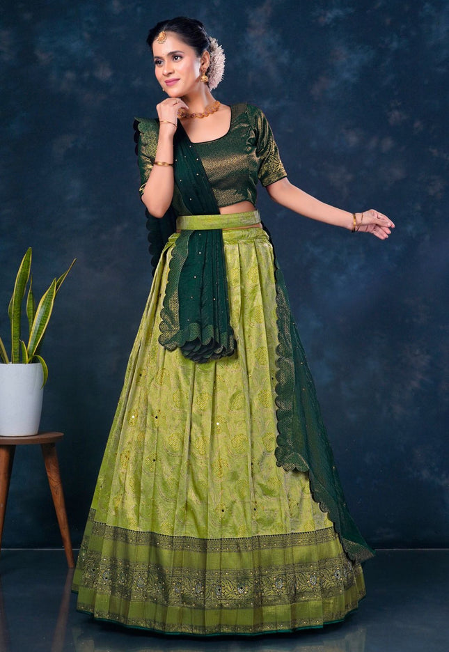 Woman in a green traditional lehenga choli with dupatta