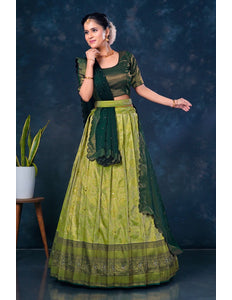 Woman in a green traditional lehenga choli with dupatta