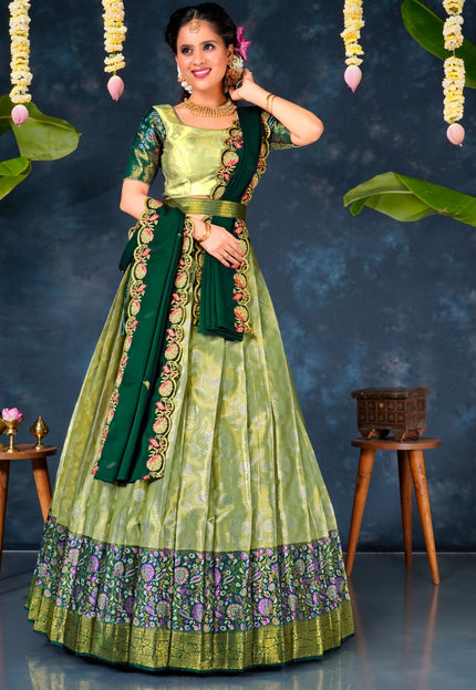 Woman in a green and light green lehenga choli with dupatta