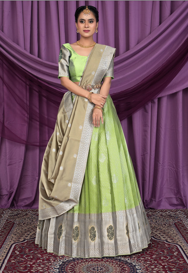 Woman wearing a green and beige lehenga choli