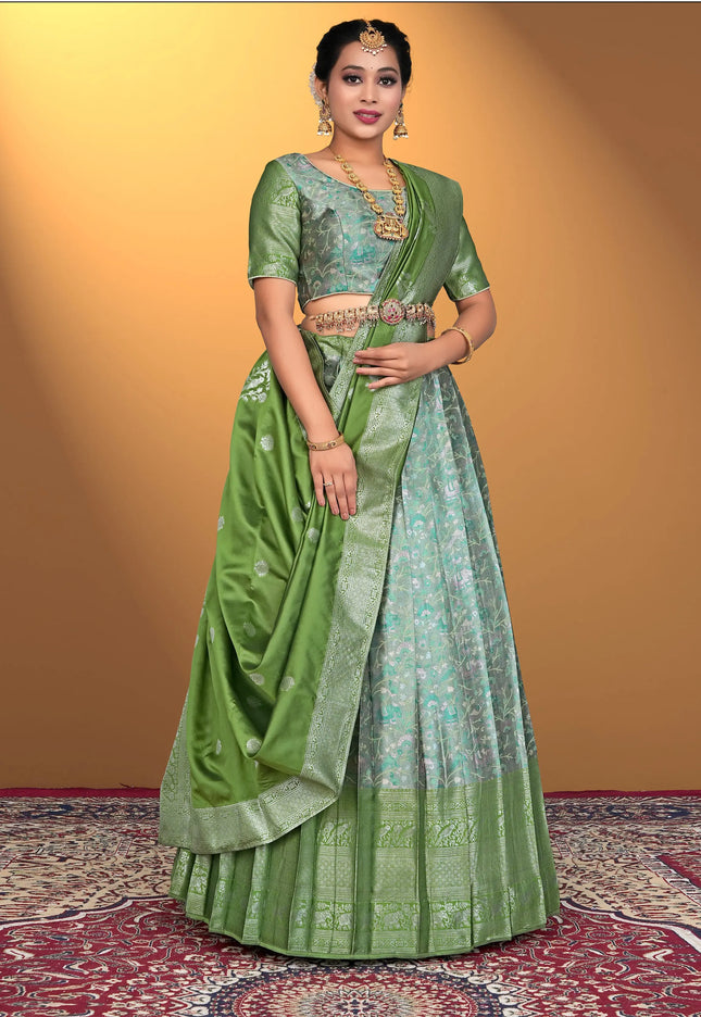 Woman wearing a green lehenga with a matching blouse