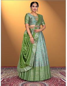 Woman wearing a green lehenga with a matching blouse