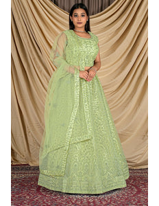 Woman wearing a light green traditional outfit