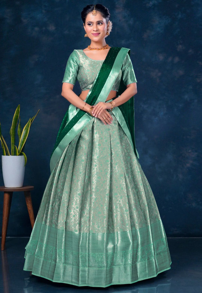 Woman in a green lehenga with a matching blouse
