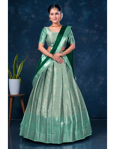 Woman in a green lehenga with a matching blouse