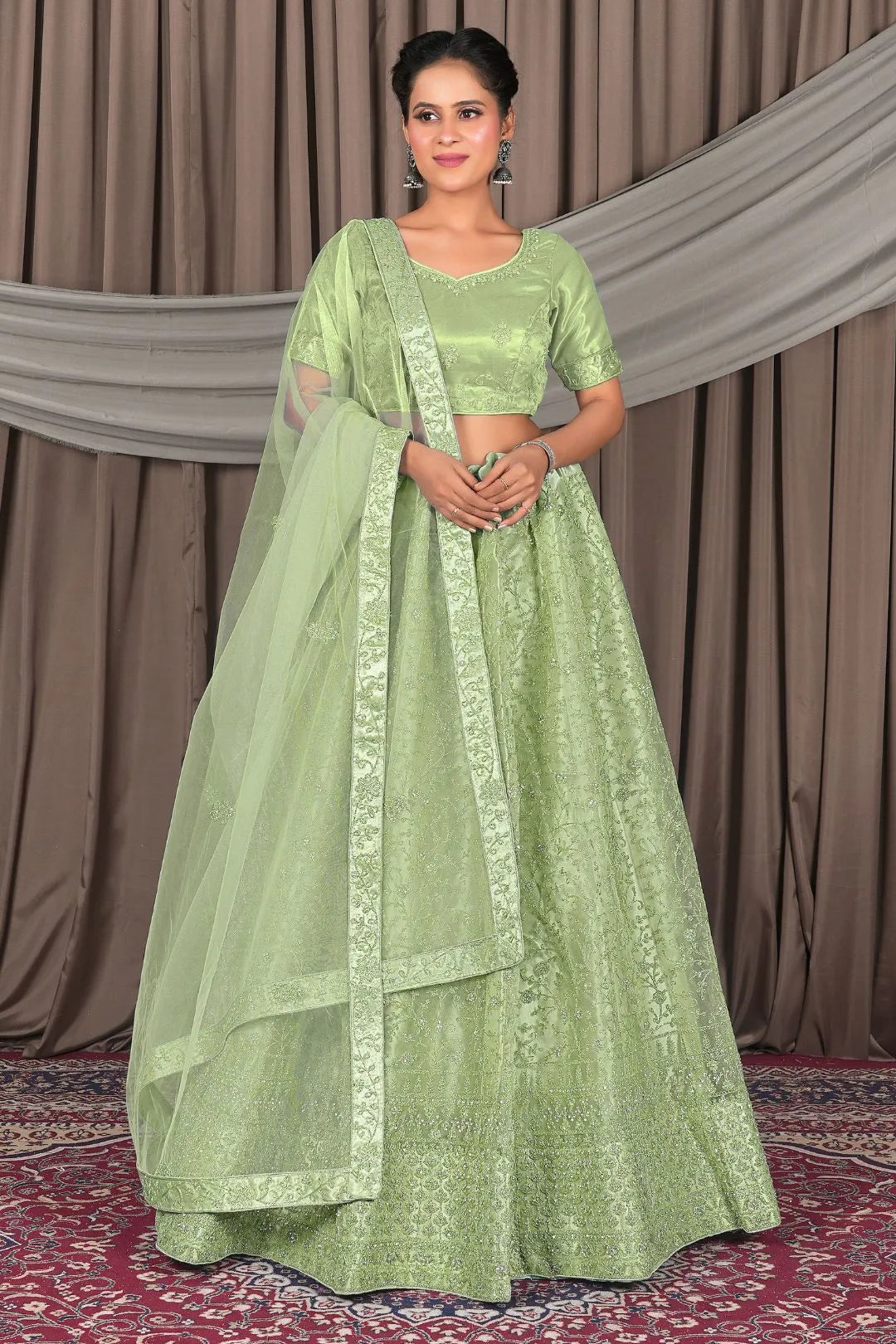 Pista Designer Net Lehenga Choli For Weddings