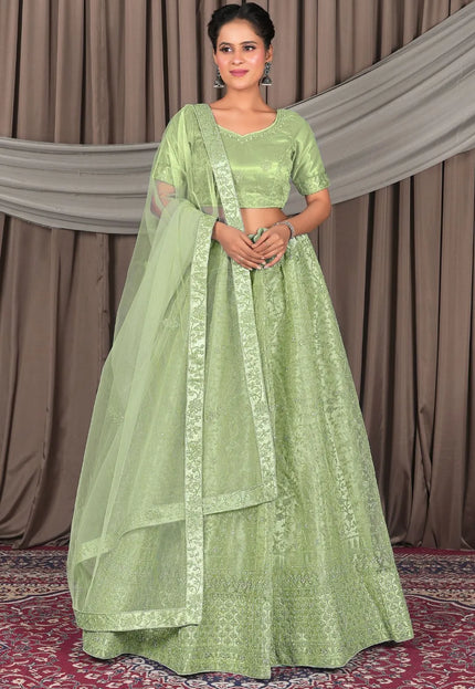 Pista Designer Net Lehenga Choli For Weddings