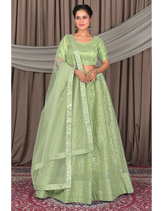 Pista Designer Net Lehenga Choli For Weddings