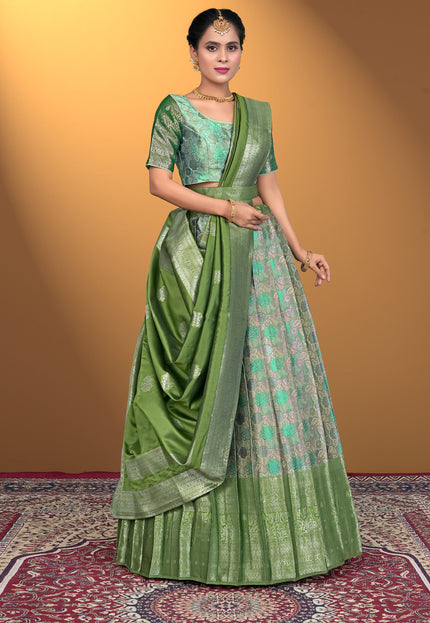 Woman wearing a green lehenga with a matching blouse
