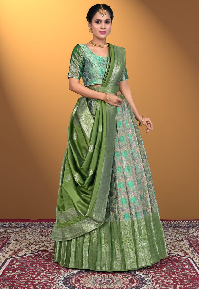 Woman wearing a green lehenga with a matching blouse
