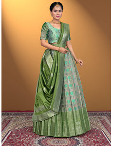 Woman wearing a green lehenga with a matching blouse