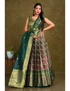 Woman wearing a green gown with a patterned design