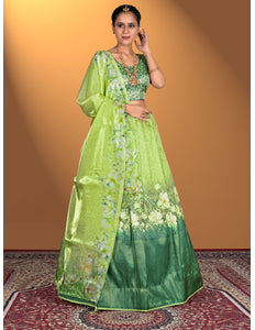 Woman wearing a green floral lehenga  with a matching blouse