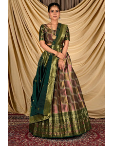 Woman wearing a traditional green lehenga with a patterned blouse