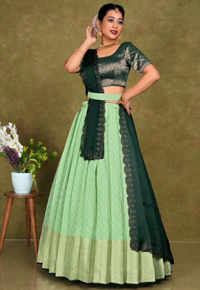 Woman wearing a green and Pista traditional outfit