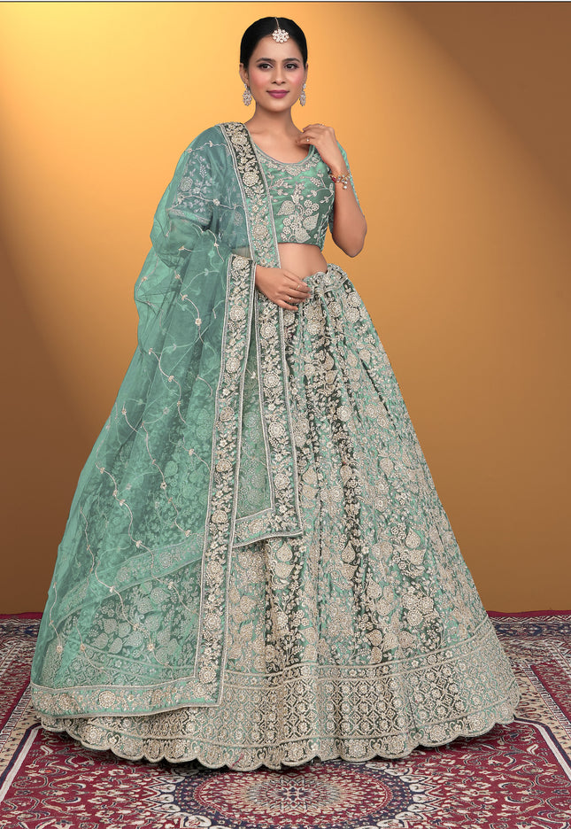 Woman wearing a traditional Pista embroidered lehenga