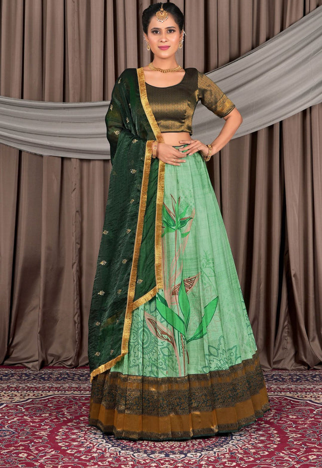 Woman wearing a green traditional lehenga choli with dupatta