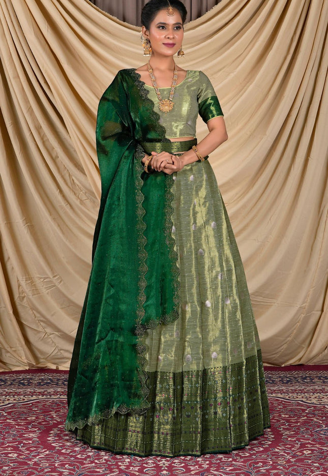 Woman wearing a green lehenga with a matching blouse