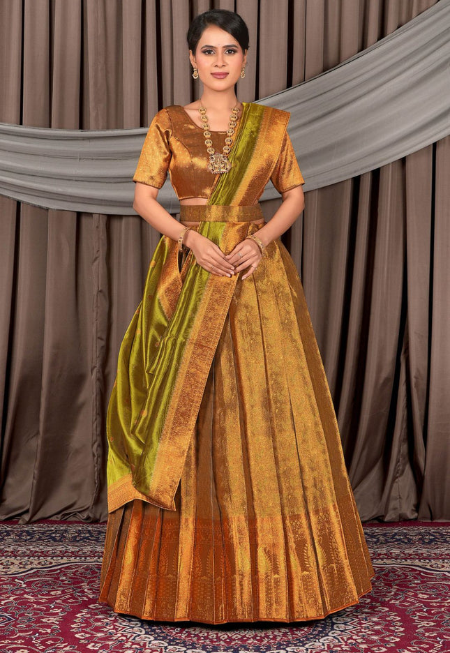 Woman wearing a traditional gold lehenga choli with dupatta
