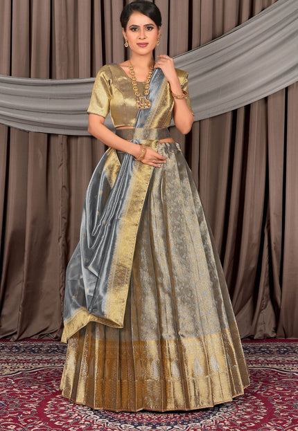 Woman wearing a traditional gray lehenga choli with dupatta