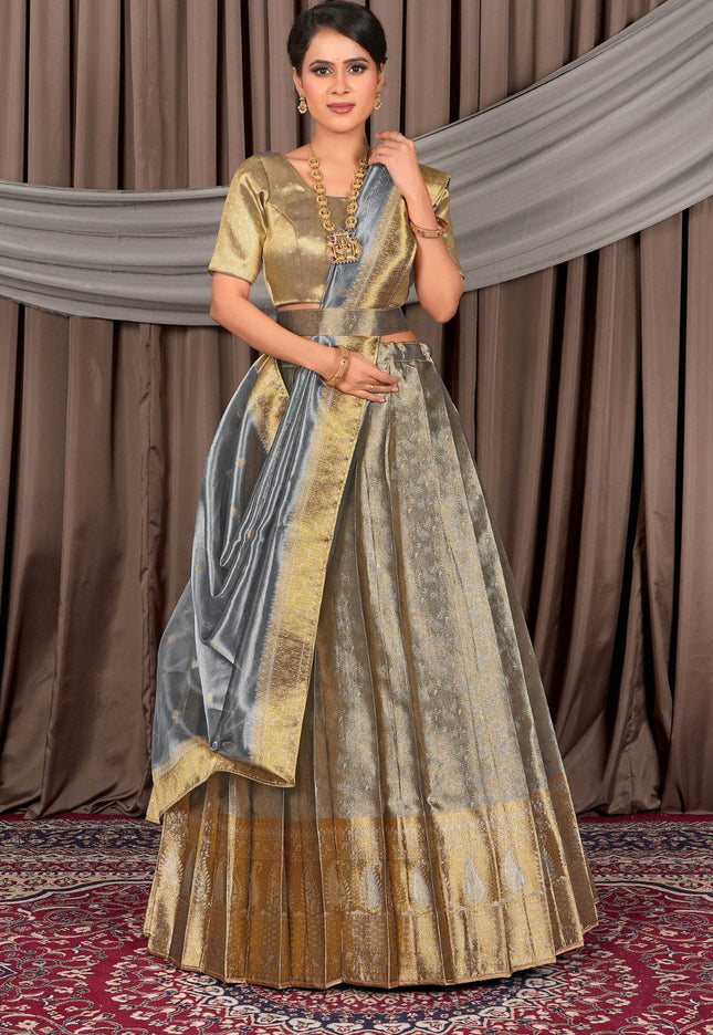 Woman wearing a traditional gray lehenga choli with dupatta