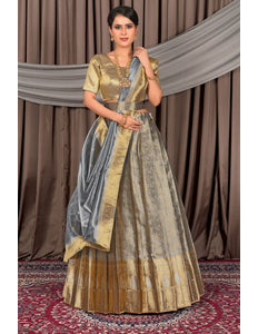 Woman wearing a traditional gray lehenga choli with dupatta