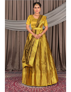 Woman wearing a yellow traditional outfit with a lehenga choli with dupatta