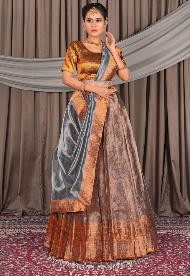 Woman wearing a traditional peach lehenga choli with dupatta