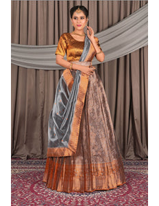 Woman wearing a traditional peach lehenga choli with dupatta