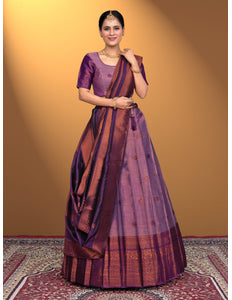 Woman wearing a traditional purple and brown lehenga choli